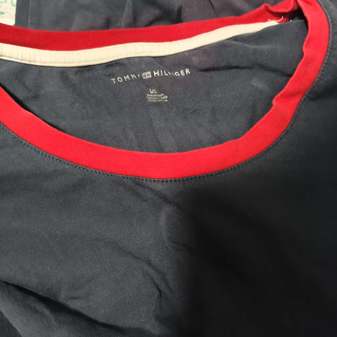 Tommy Hilfiger Navy Dress (Category: Dresses) located in Manila. Submitted by stuff_finder (Listing ID 1430527586, Image 2). Description: Navy dress from Tommy Hilfiger with red and white accents. Features a round neckline and short sleeves with red cuffs. The dress has a white band at the bottom, followed by a red band. The Tommy Hilfiger logo is visible on the chest. The dress is a size L..