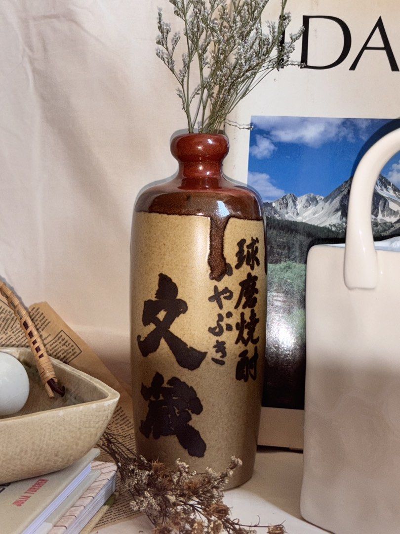 Vintage Japanese Ceramic Vase (Category: Vases & Decorative Bowls) located in Manila. Submitted by jullialm (Listing ID 1430577183, Image 1). Description: With sticker Very nice in actual, atleast 9in height * Send DM or message to Mine * Please manage your expectations. Note that these are vintage items that may show signs of usage which is part of their story as well. Any flaw will be disclosed and all items posted are as is. * Strictly no dele