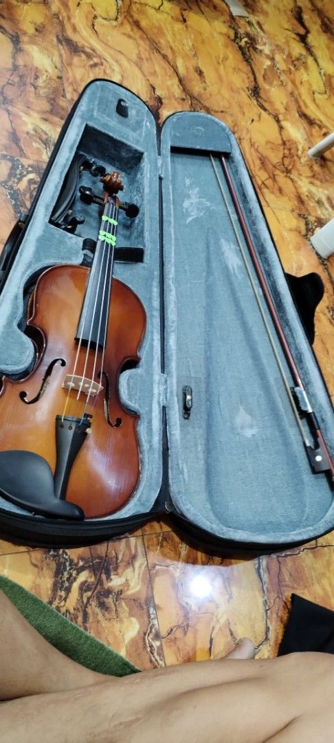 Violin with Case and Bow (Category: Musical Instruments) located in Caloocan City. Submitted by rowely_jpn (Listing ID 1430512481, Image 1). Description: Violin comes with a case and bow. The violin has strings and a bridge. The case is lined with a gray material. The bow is included.3/4 size ...