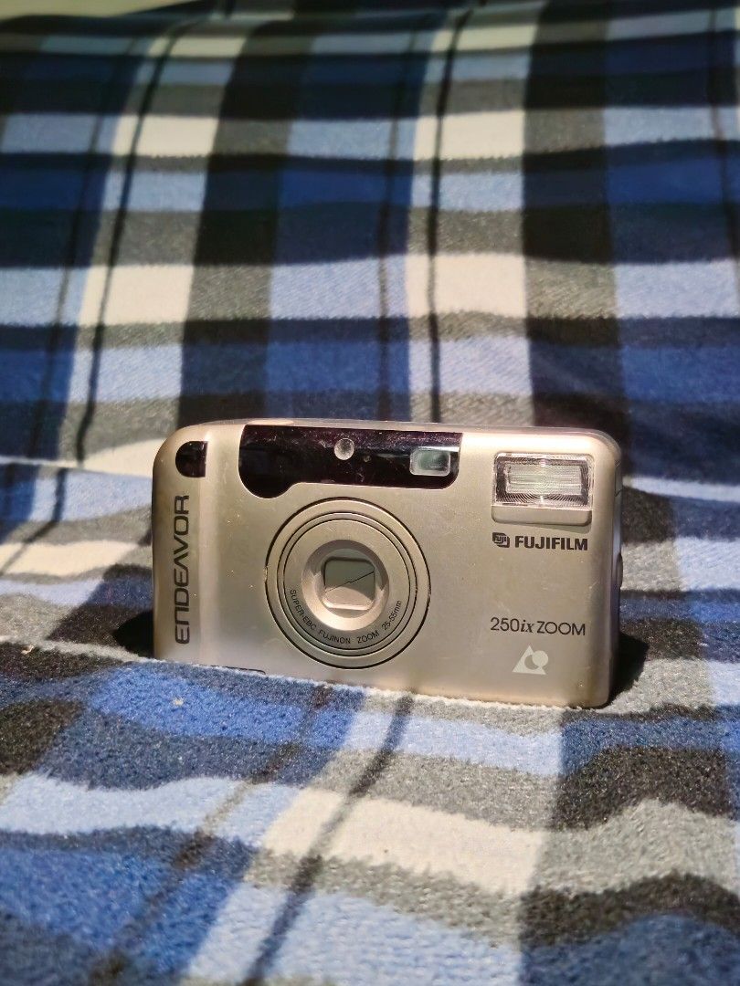 Working Film Cameras for sale (Category: Cameras) located in Manila. Submitted by shindae17 (Listing ID 1430521618, Image 1). Description: Three vintage point-and-shoot cameras are available. The first is a Fujifilm Endeavor 250 Zoom. The second is a Minolta with a 38-70mm lens. The third is a Pentax Espio 738S. All cameras have a built-in flash. They are compact and suitable for casual photography. Pm for more details(vid and price).