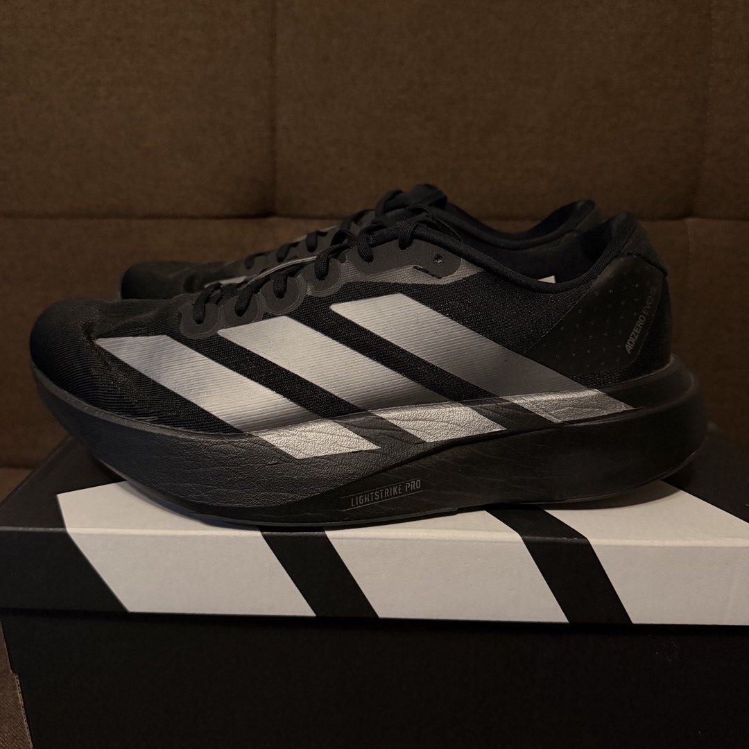 adidas adizero Evo SL W (Category: Sneakers) located in Pasay City. Submitted by joshwhacker (Listing ID 1430770591, Image 3). Description: Adidas Adizero Evo SL W running shoes in black. Features the Adidas logo on the heel and sides. The box indicates a size 9 (US). The soles have Continental branding..