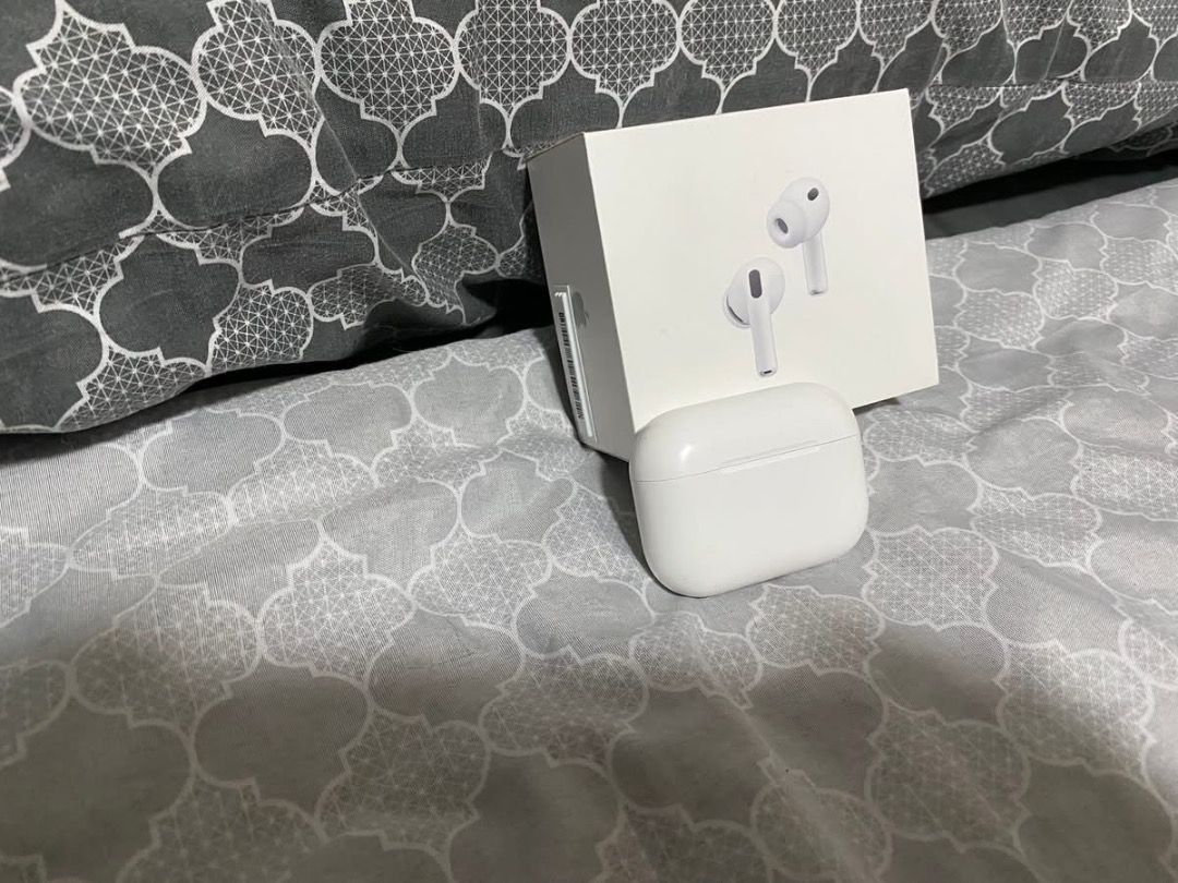 AIRPODS PRO 2 (Category: Earphones) located in Caloocan City. Submitted by mrbigdreams (Listing ID 1430709671, Image 2). Description: Includes the AirPods Pro, charging case, and various ear tips. Also comes with a black Spigen case and a black protective cover. The box is included. The earphones and case are white..