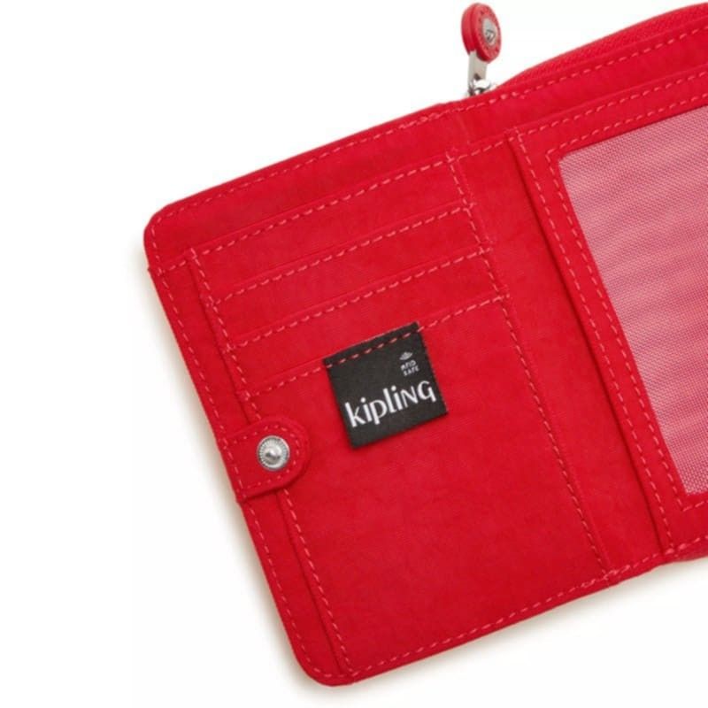 Authentic Kipling Money Love Red Rouge Wallet (Category: Wallets & Card holders) located in Davao. Submitted by jilly07 (Listing ID 1430718536, Image 3). Description: Kipling wallet features multiple card slots, a zippered compartment, and a snap closure. The interior includes a clear ID window and additional storage. The wallet has a zip-around closure and the Kipling logo is visible inside. Used only ONCE to check. GOOD as NEW. In EXCELLENT con