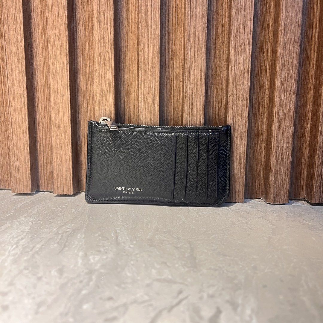 Authentic Saint Laurent Card Holder (Category: Luxury Bags & Wallets) located in Trece Martires City. Submitted by imwelllovedvintage (Listing ID 1430722354, Image 1). Description: Authentic Saint Laurent Card Holder •stamp is faded •rubber linings need retouch •one card slot has cut rubber lining •with flaws but useable as is •angat na cloth lining inside •sleek and compact ❌LOW BALLERS WILL BE IGNORED ❌NO 🍊 CHECKOUT ❗️STRICTLY 1 DAY RESERVATIO