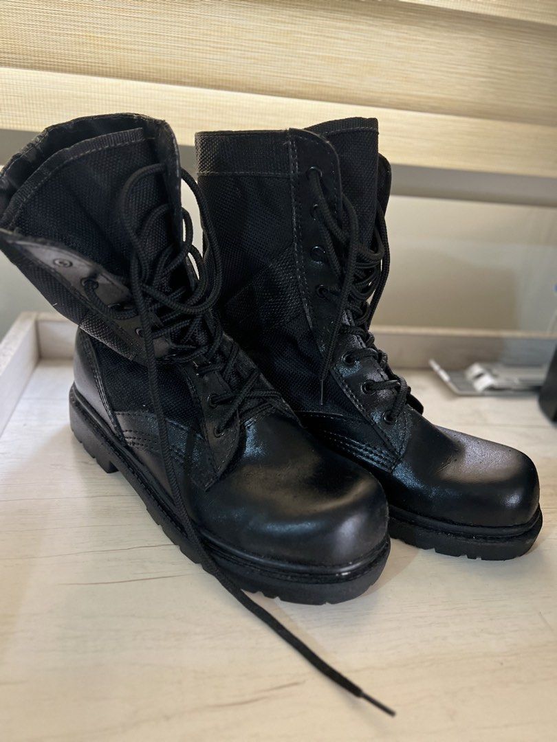 Black Combat Boots (Category: Boots) located in Makati City. Submitted by esila.essentials (Listing ID 1430664551, Image 2). Description: Black combat boots with laces. The boots have a combination of leather and fabric. They have a sturdy sole and a mid-calf height. They are a classic design, suitable for both casual and practical wear..