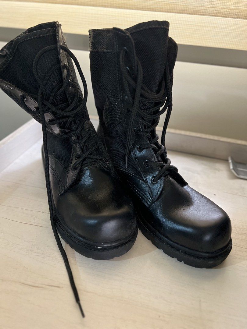 Black Combat Boots (Category: Boots) located in Makati City. Submitted by esila.essentials (Listing ID 1430664551, Image 1). Description: Black combat boots with laces. The boots have a combination of leather and fabric. They have a sturdy sole and a mid-calf height. They are a classic design, suitable for both casual and practical wear..
