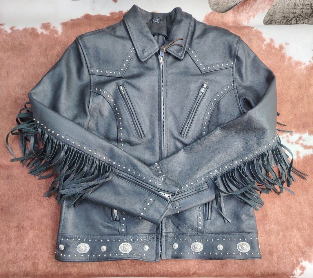 Black Leather Jacket with Fringes (Category: Coats, Jackets and Outerwear) located in La Trinidad. Submitted by padasem_kadi (Listing ID 1430628589, Image 1). Description: Stylish black leather jacket featuring decorative studs and fringes. It has a zip-up front, multiple zippered pockets, and decorative silver-toned embellishments. The jacket has a classic collar and a lined interior. Made in Pakistan. Measurements are provided in the images..