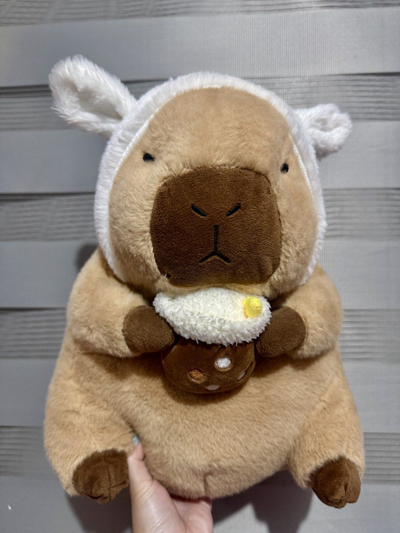 Capybara with milktea plush toy Big size (Category: Plushies & Soft Toys) located in Manila. Submitted by bcbg3217 (Listing ID 1430642124, Image 1). Description: Like new condition big size No etiketa Actual photos are posted No issues or flaws unless stated ⚠️NO INCLUSIONS (dustbag,tags etc.) Please check the photos thoroughly before placing an order JnT regular or Lalamove COD for Metro Manila ⚠️BUY AT YOUR OWN RISK⚠️ Prices are still negotiabl