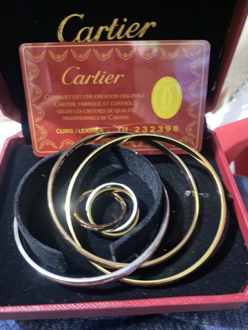Cartier Trinity Bracelet (Category: Bracelets) located in Zamboanga. Submitted by smartstyle (Listing ID 1430716711, Image 3). Description: Cartier Trinity bracelet. Features three interlocking bands in gold, rose gold, and white gold. Comes with the original Cartier box and authenticity card. The bracelet is a classic design, perfect for everyday wear or special occasions. A timeless piece of jewelry. Ring and bangle Premium quality.. non tarnis