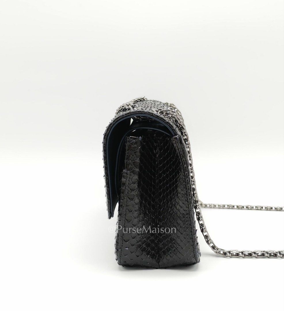 Chanel Reissue 2.55 Size 225 Exotic Python Black & Gray Series in Silver Hardware Series 27 (Category: Luxury Accessories) located in Taguig. Submitted by pursemaison (Listing ID 1430698204, Image 3). Description: Chanel Reissue 2.55 Size 225 Exotic Python Black & Gray Series in Silver Hardware Series 27 Price: Php 385,000.00 Condition: Like New (9.8/10) Exterior: Minor rubs on corners Interior: None Hardware: None Inclusions: Box, Dust Bag, Auth