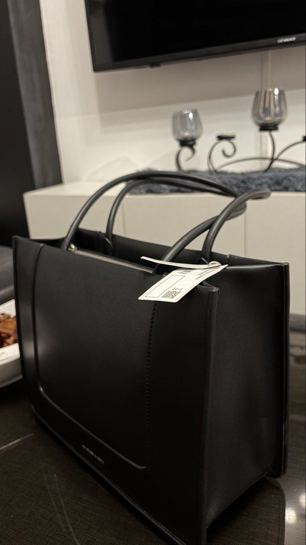 Charles & Keith Daylla Tote Bag (Category: Tote Bags) located in Paranaque City. Submitted by preamata (Listing ID 1430674460, Image 2). Description: Charles & Keith Daylla Tote Bag Used twice only. With tag. Original Price: 4,399.00.
