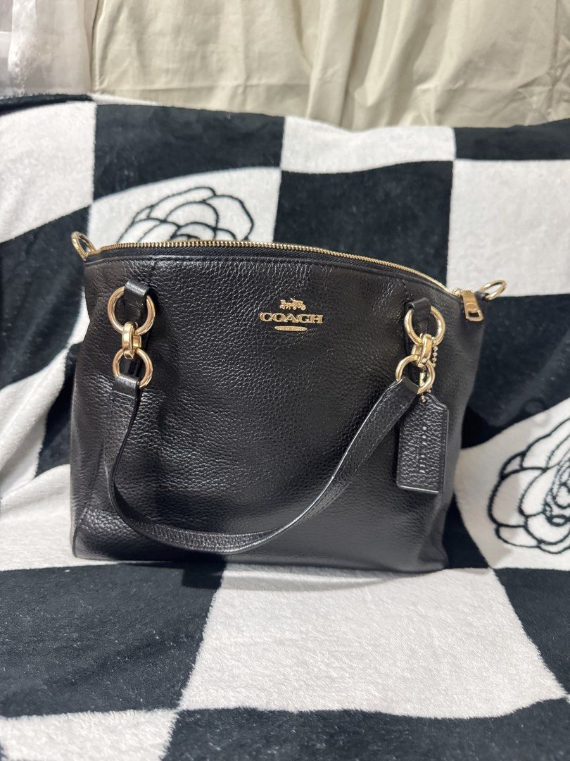 Coach Small Kelsey Satchel (Category: Luxury Bags & Wallets) located in Makati City. Submitted by prelovedbyhaillie (Listing ID 1430738590, Image 1). Description: - Authentic Coach handbag - Black pebbled leather - Gold-tone hardware - Top zipper closure - Detachable Coach tag - Interior Coach label - Includes shoulder strap.