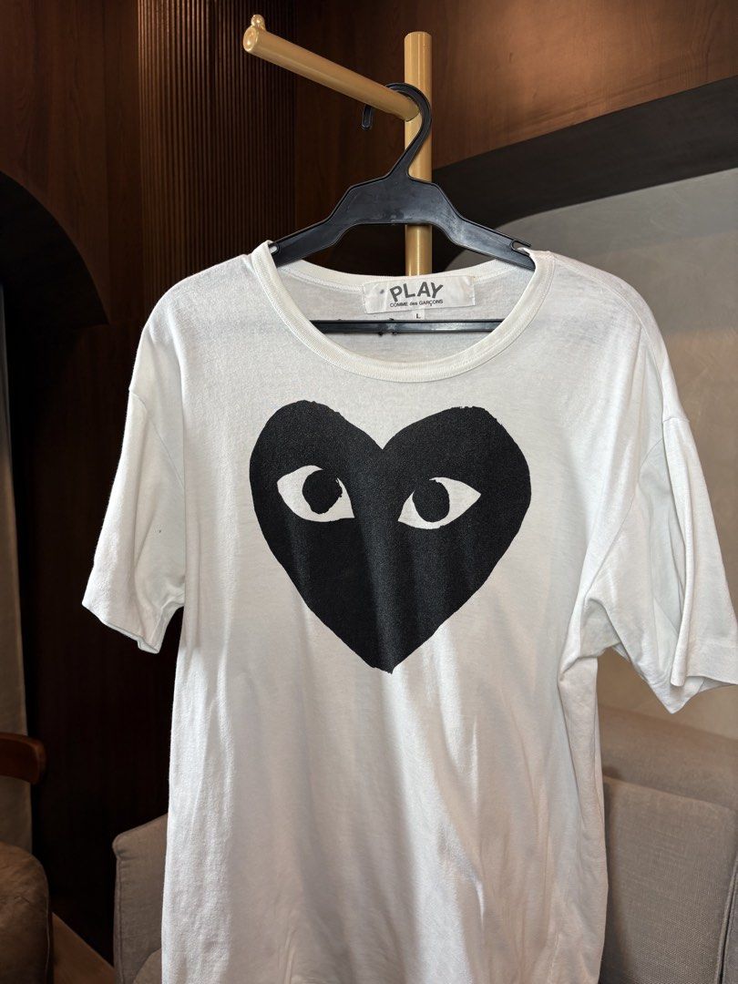 Comme des Garcons Play Heart Tee (Category: Shirts) located in Manila. Submitted by ccuadralaw (Listing ID 1430662790, Image 1). Description: Shoulder 49cm Bust 49cm Sleeves 19cm Neck 22cm Length 67cm .