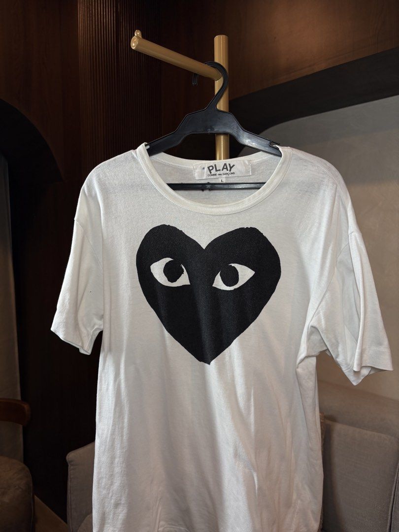 Comme des Garcons Play Heart Tee (Category: Shirts) located in Manila. Submitted by ccuadralaw (Listing ID 1430662790, Image 2). Description: Shoulder 49cm Bust 49cm Sleeves 19cm Neck 22cm Length 67cm .
