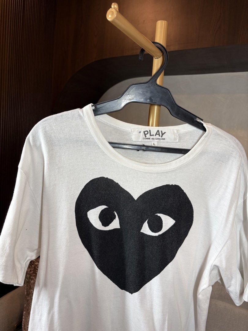 Comme des Garcons Play Heart Tee (Category: Shirts) located in Manila. Submitted by ccuadralaw (Listing ID 1430662790, Image 3). Description: Shoulder 49cm Bust 49cm Sleeves 19cm Neck 22cm Length 67cm .