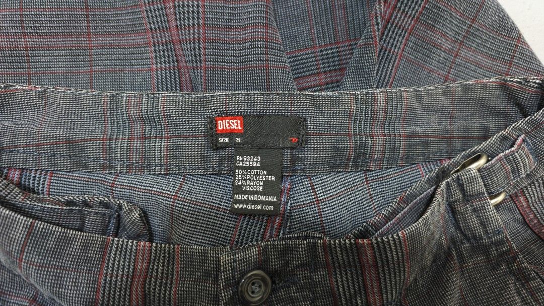 Diesel Plaid Pants (Category: Jeans) located in Bulacan. Submitted by thrifttoria1036372 (Listing ID 1430645020, Image 1). Description: Diesel plaid pants with a unique design. Features a button closure and a buckle detail. The pants have a gray and red plaid pattern. The tag indicates the pants are made of cotton and viscose. Waist line - 30-36 Thighs - 10 Leg opening - 9.5 Inseam - 31 Length - 41.