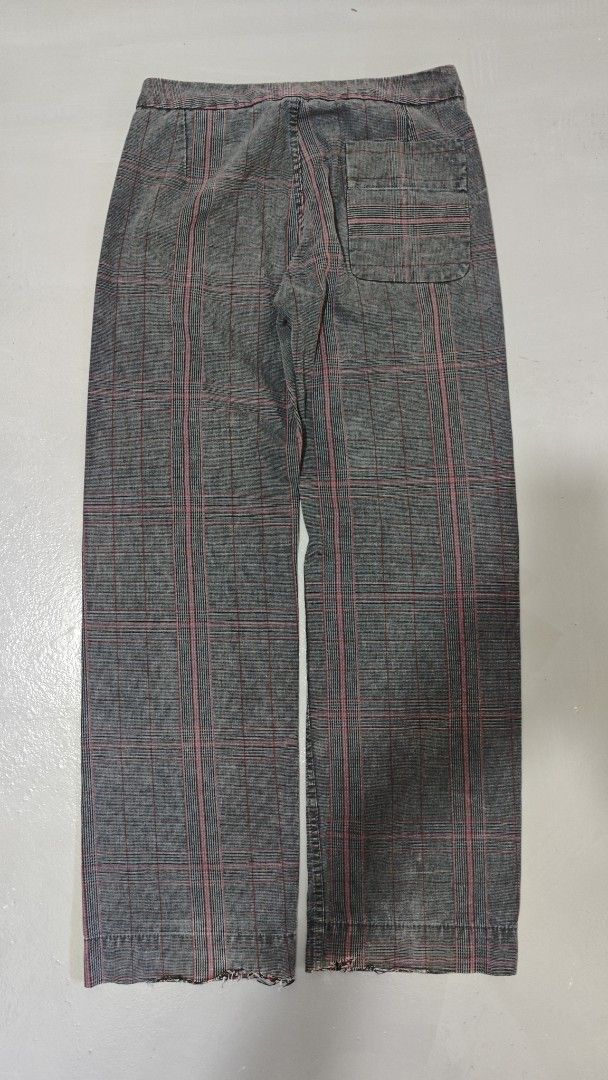 Diesel Plaid Pants (Category: Jeans) located in Bulacan. Submitted by thrifttoria1036372 (Listing ID 1430645020, Image 3). Description: Diesel plaid pants with a unique design. Features a button closure and a buckle detail. The pants have a gray and red plaid pattern. The tag indicates the pants are made of cotton and viscose. Waist line - 30-36 Thighs - 10 Leg opening - 9.5 Inseam - 31 Length - 41.