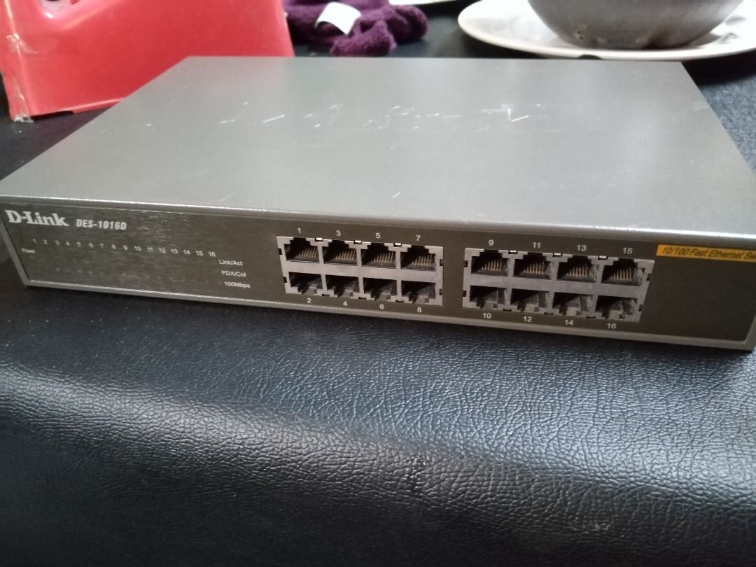 D-Link DES-1016D 16-Port Fast Ethernet Switch (Category: Cables & Adaptors) located in Manila. Submitted by maybonifacio (Listing ID 1430686878, Image 3). Description: D-Link DES-1016D 16-port Fast Ethernet switch. Features 16 RJ45 ports for network connectivity. Model number is DES-1016D. Hardware version is D4. Includes a power indicator and 10/100 Fast Ethernet ports. Made in China..