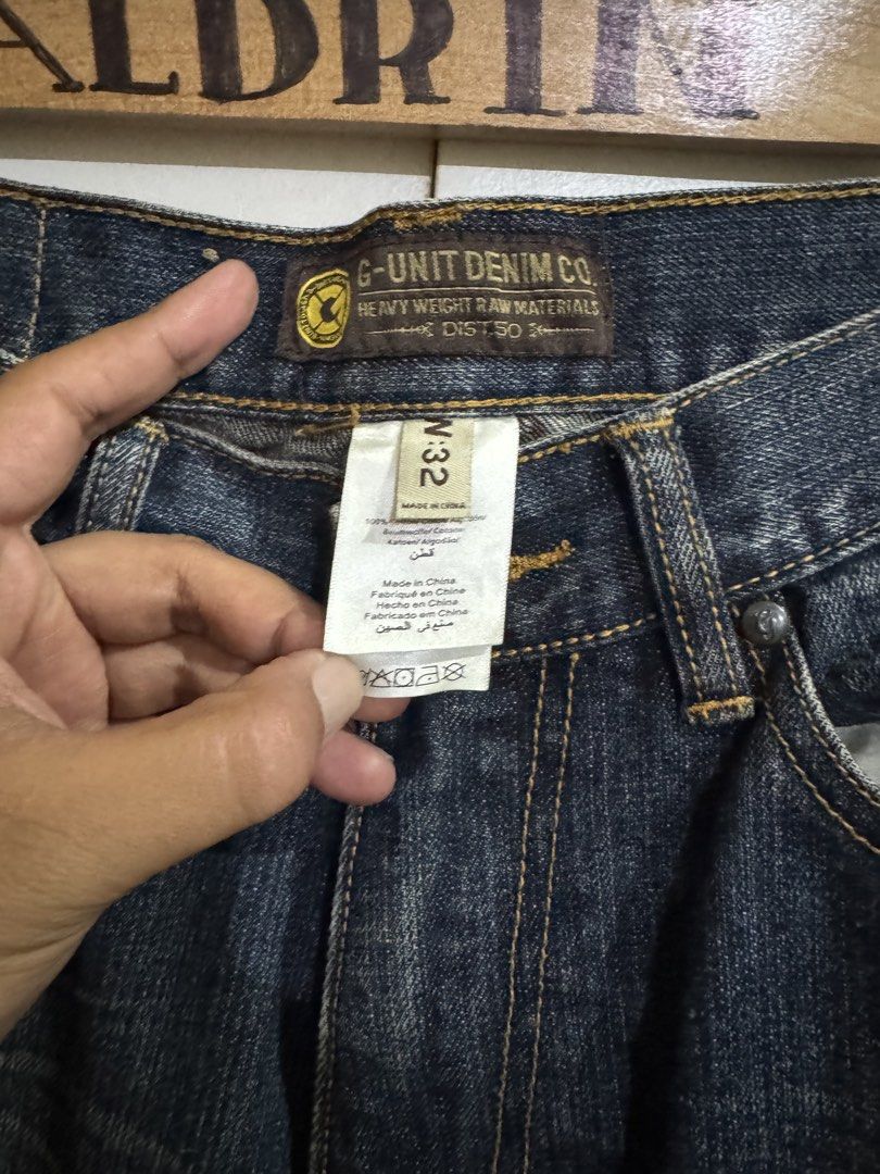 G-Unit Denim Co. Jeans Size 32 (Category: Jeans) located in Cavite. Submitted by aldrindela40142 (Listing ID 1430658878, Image 2). Description: G-Unit Denim Co. jeans in size 32. Features a dark wash with decorative stitching on the back pockets. The jeans have a button closure with the G-Unit logo. Made from heavy-weight raw materials. The jeans have a classic five-pocket design and a relaxed fit..