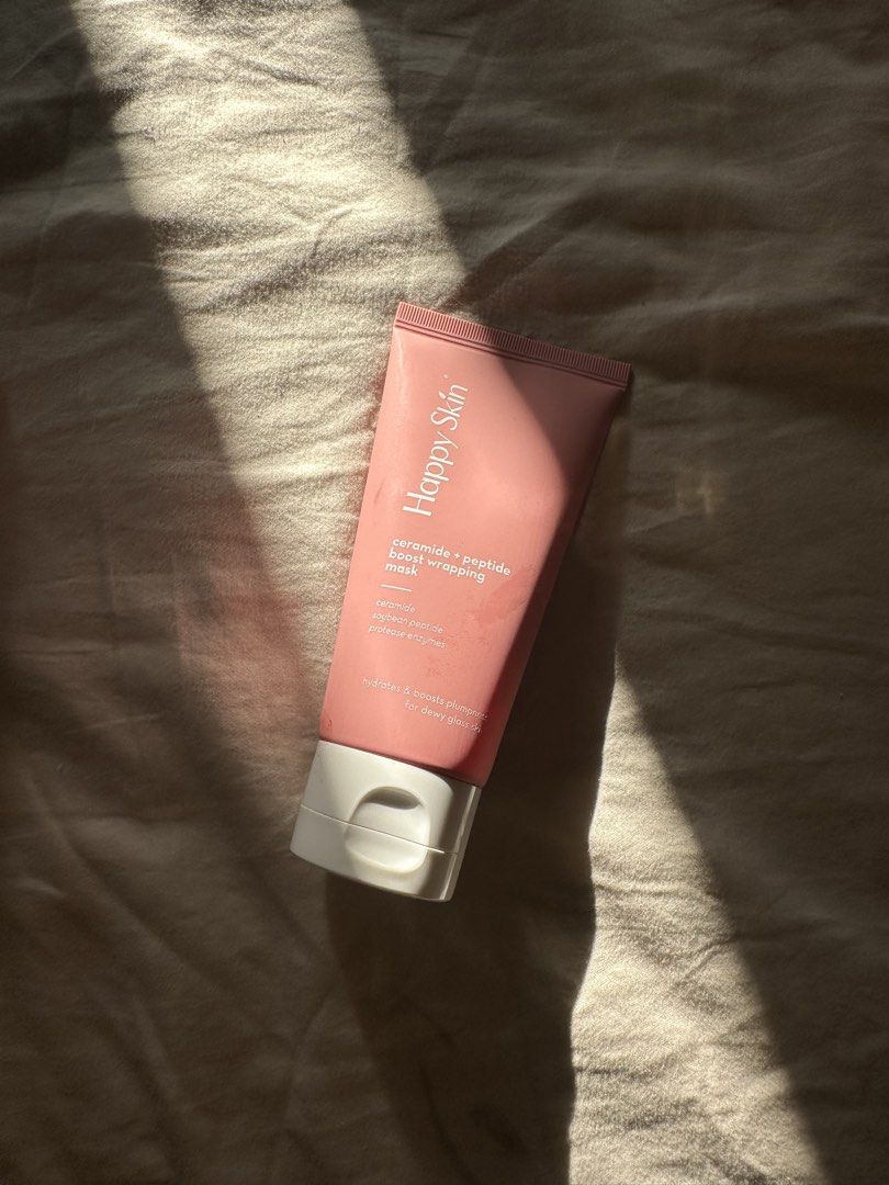 Happy Skin Ceramide + Peptide Boost Wrapping Mask (Category: Face Care) located in Taguig. Submitted by mandms09 (Listing ID 1430686427, Image 1). Description: Haven’t used this! - Happy Skin Ceramide + Peptide Boost Wrapping Mask - Contains ceramide, soybean peptide, and proteo-enzymes - Hydrates and boosts skin plumpnedd - Gives a dewy glow - Comes in a pink tube with a white cap.