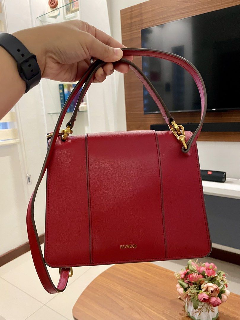 HAVVMOON Red Handbag with Gold Buckle (Category: Luxury Bags & Wallets) located in Paranaque City. Submitted by ol.authentic.ph (Listing ID 1430636445, Image 3). Description: 100% Original Havmoon. Genuine Leather in Excellent Condition. Classy Red Day to Night Bag. Front and Back Flap Magnetic lock. Perfect Gold-tone Hardware Condition. Crossbody Strap, 101% Prisitine. Suede inside. Scratch proof. ** Message me. I can slightly negotiate. Preferr