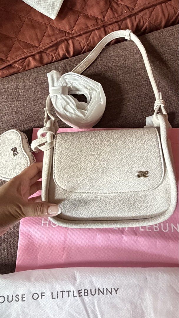 PRELOVED HOLB MINI PENELOPE FOR SALE (Category: Cross-body Bags) located in Angeles City. Submitted by joshlp (Listing ID 1430607006, Image 1). Description: BRAND NEW HOLB MINI PENELOPE WITH HEART WALLET (WHITE COLOR) Bought in BKK last 4/5/26 Last price already.