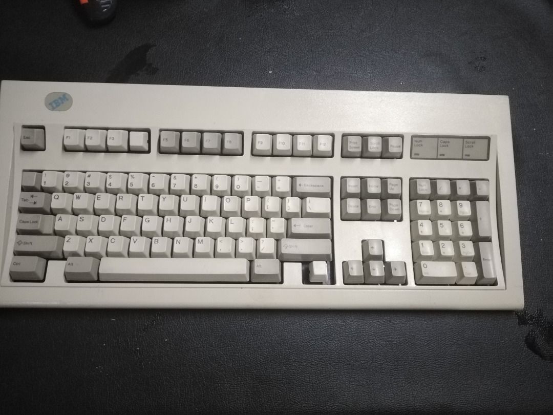 IBM Lexmark Mechanical Keyboard (Category: Computer Keyboard) located in Manila. Submitted by maybonifacio (Listing ID 1430692375, Image 1). Description: Vintage IBM Lexmark mechanical keyboard. Features a full-size layout with a numeric keypad. Manufactured by Lexmark. Part number 52G9658. Made in USA. Production date of July 27, 1993. Includes the IBM logo on the top left corner. The keycaps are a light beige color. AS IS .