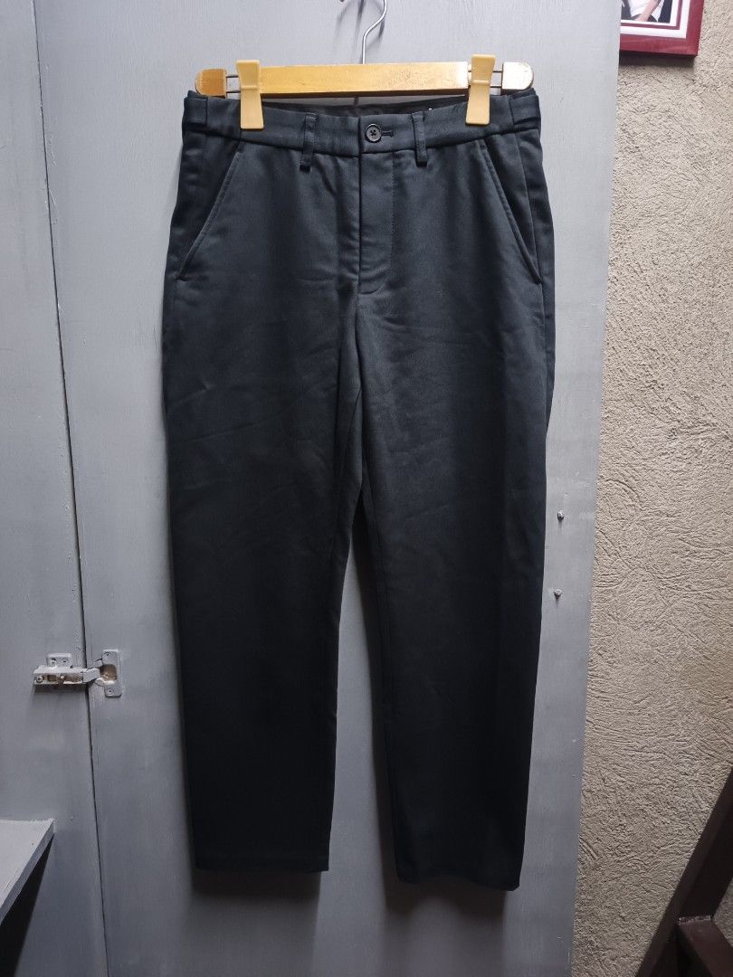 Initial Gentleman Ankle Length Tapered Slim Pants (Category: Trousers) located in Dasmarinas. Submitted by jessputrages (Listing ID 1430762130, Image 1). Description: These Initial Gentleman pants feature an ankle-length, tapered slim fit. The pants are a dark color, possibly black or a very dark grey. The tag indicates the model is P07. The material composition includes polyester, cotton, and spandex. The pants have a button and zipper closure. 