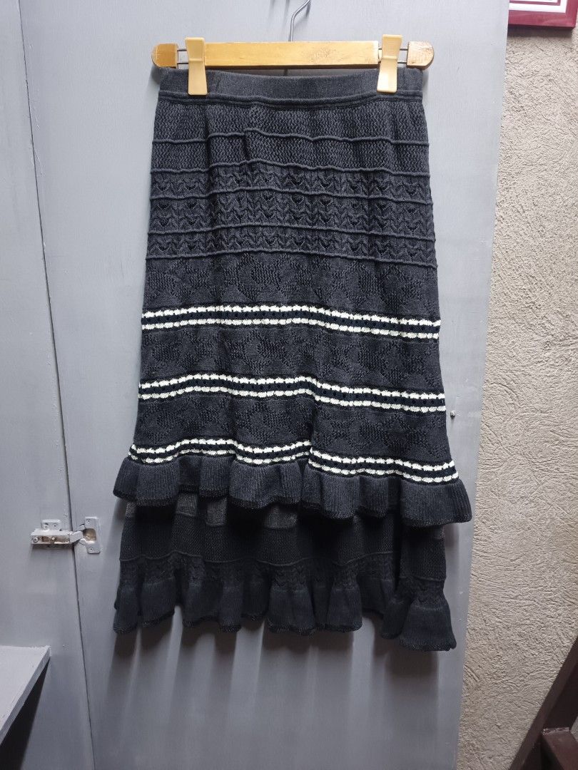 Initial Knit Maxi Skirt (Category: Skirts) located in Dasmarinas. Submitted by jessputrages (Listing ID 1430761740, Image 1). Description: Initial maxi skirt features a tiered design with a knit construction. It has a dark grey color with white stripes. The skirt is made of a blend of materials, including cotton, polyester, acrylic, and nylon. The lining is 100% polyester. It has a comfortable elastic waistband..