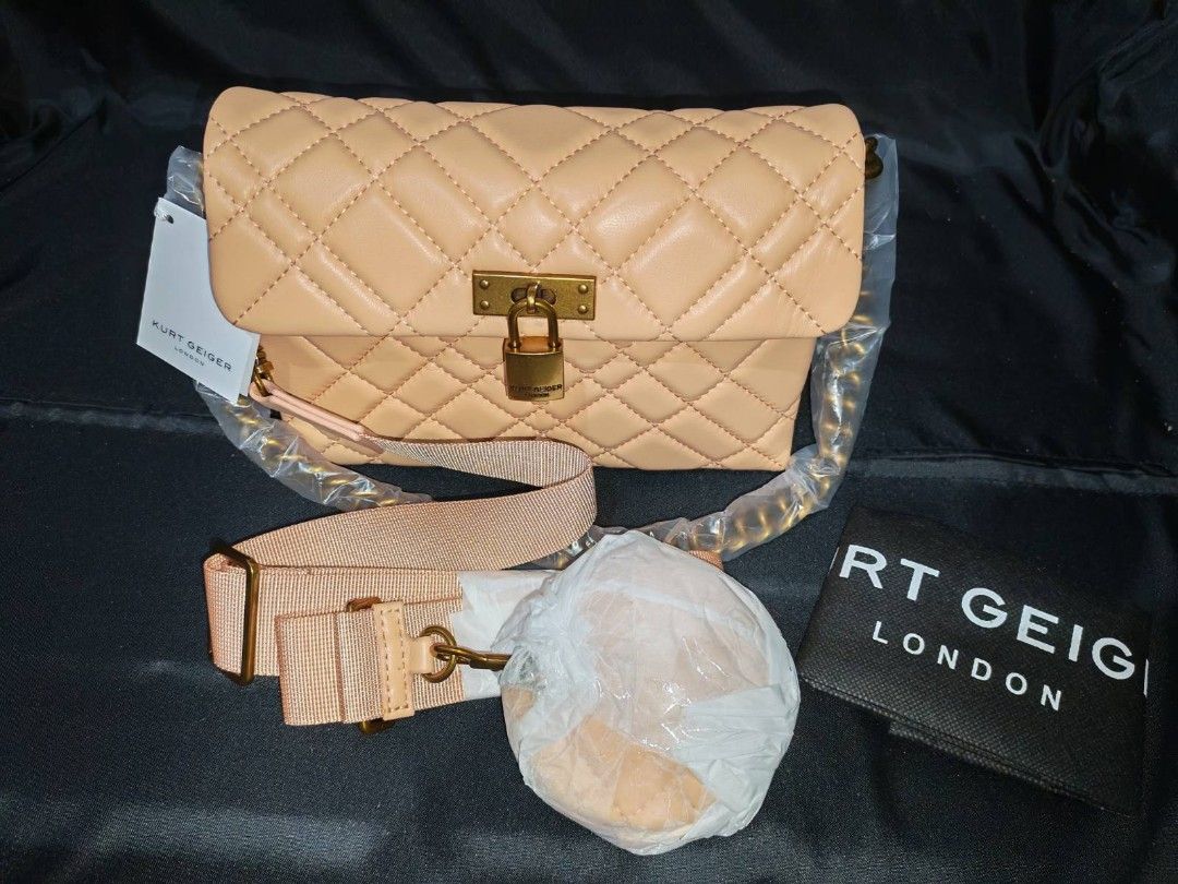 Kurt Geiger London - CrossBody Bag (Category: Luxury Bags & Wallets) located in Manila. Submitted by jewfindshop (Listing ID 1430766607, Image 3). Description: Kurt Geiger London handbag / crossbody bag features a quilted design with a gold-tone lock closure. It includes a detachable strap and a chain strap. The interior is black. The bag comes with a dust bag and tags. The colour is a light peach..