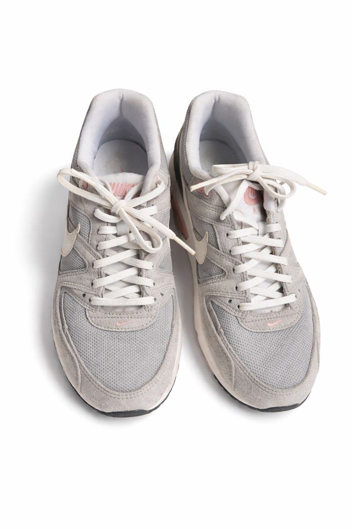 Nike Air Max Light Grey Pink Sneakers (Category: Sneakers) located in Antipolo. Submitted by cl026 (Listing ID 1430662511, Image 2). Description: - Nike Air Max sneakers - Color: Grey and Pink - Size: US 9 - Upper: Mesh and Suede - Features: Visible Air Max unit, white laces and swoosh, pink accents - Condition: Soles show slight wear.