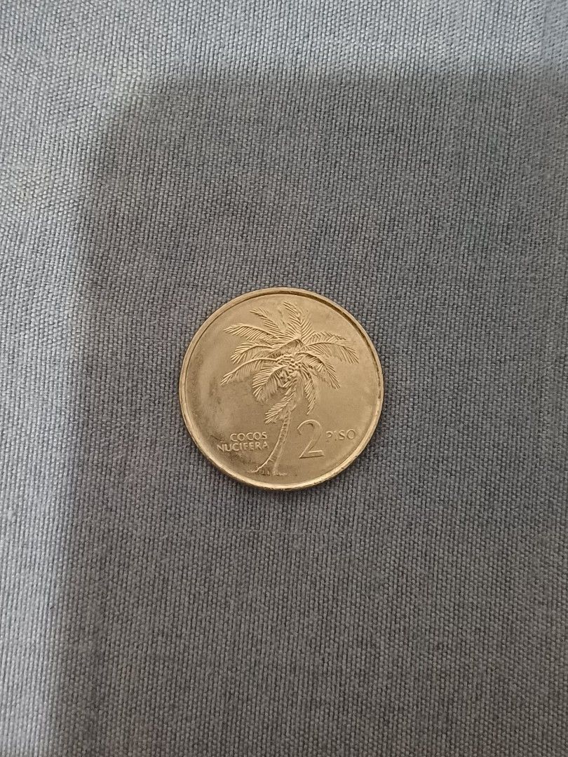 Philippine 25 Sentimo Coin 1982 (Category: Currency) located in General Trias. Submitted by calmdragon.2288 (Listing ID 1430716106, Image 2). Description: Philippine 25 Sentimo coin from 1982. The coin features the inscription "REPUBLIKA NG PILIPINAS" and the year 1982 on one side. The other side shows a palm tree. A great addition to any coin collection..