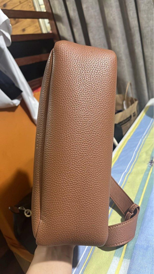 Polène Umi in Textured Camel (Category: Luxury Bags & Wallets) located in Mandaluyong City. Submitted by marycris89 (Listing ID 1430738234, Image 3). Description: Details: • Brand: Polène • Model: Umi (discontinued / rare) • Material: Genuine calf leather • Color: Camel • Condition: Very Good 4/5 • Can be worn as shoulder bag or crossbody • With zipper closure • No major flaws / minimal signs of use • Clean inside and out.
