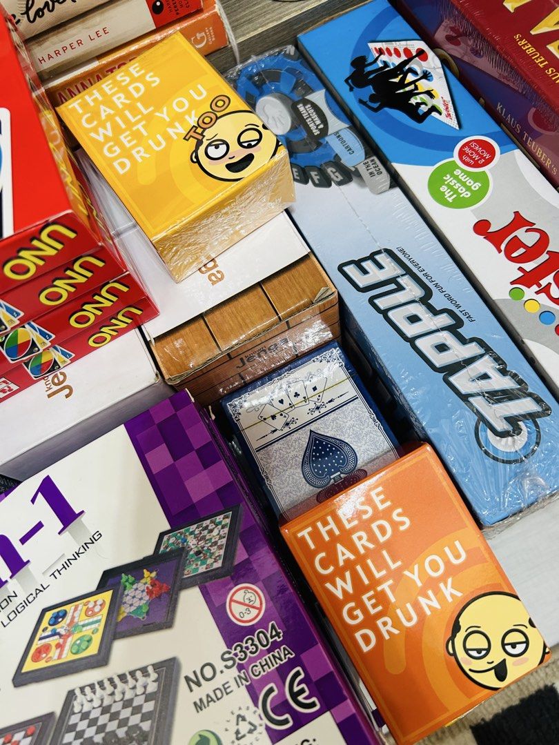 Scrabble, Risk It or Drink It, Uno, and More (Category: Board Games & Puzzles) located in Quezon City. Submitted by playboxph (Listing ID 1430794631, Image 2). Description: Assorted board games available. Includes Scrabble Original, Risk It or Drink It, Uno, and other card and board games. Some games are designed for couples or groups. Perfect for game nights and gatherings. All games appear to be sealed and ready to play..