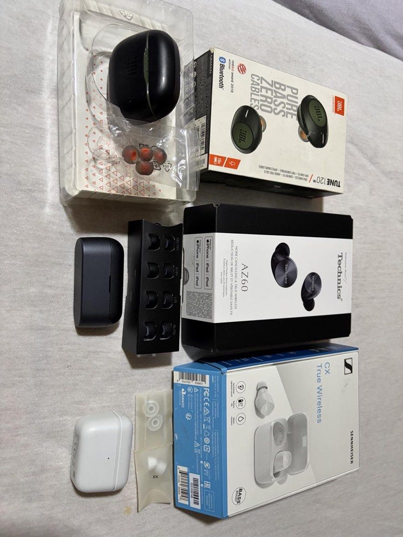 Sennheiser CX True Wireless, Technics AZ60, JBL Tune 120 (Category: Earphones) located in Manila. Submitted by muddyyys.eli (Listing ID 1430776734, Image 2). Description: - Sennheiser CX True Wireless (White) - Technics AZ60 (Black) - JBL Tune 120 (Green) - All earphones include: - Original boxes - Accessories - Extra ear tips - Images show charging cases. TAKE ALL FOR 12k.