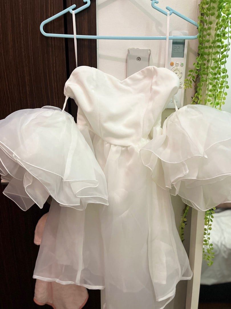 Shein White Off-Shoulder Dress (Category: Dresses) located in Taguig. Submitted by gzcollections (Listing ID 1430757322, Image 2). Description: White off-shoulder dress with ruffled sleeves. Features a sweetheart neckline and a flared skirt. Suitable for special occasions or events. The dress is short in length..