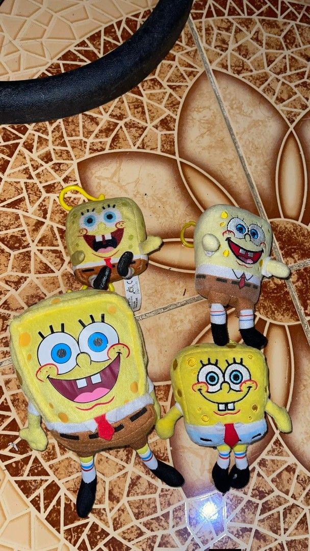 Spongebob Squarepants Plush Toys Charms (Category: Plushies & Soft Toys) located in Cotabato. Submitted by hanshasells03 (Listing ID 1430675597, Image 1). Description: Set of Spongebob Squarepants plush toys. Includes four different Spongebob plushies. Two are larger, and two are smaller keychain-sized. All have the classic Spongebob design with yellow bodies, brown pants, red ties, and black shoes. Perfect for Spongebob fans or collectors. 400 4