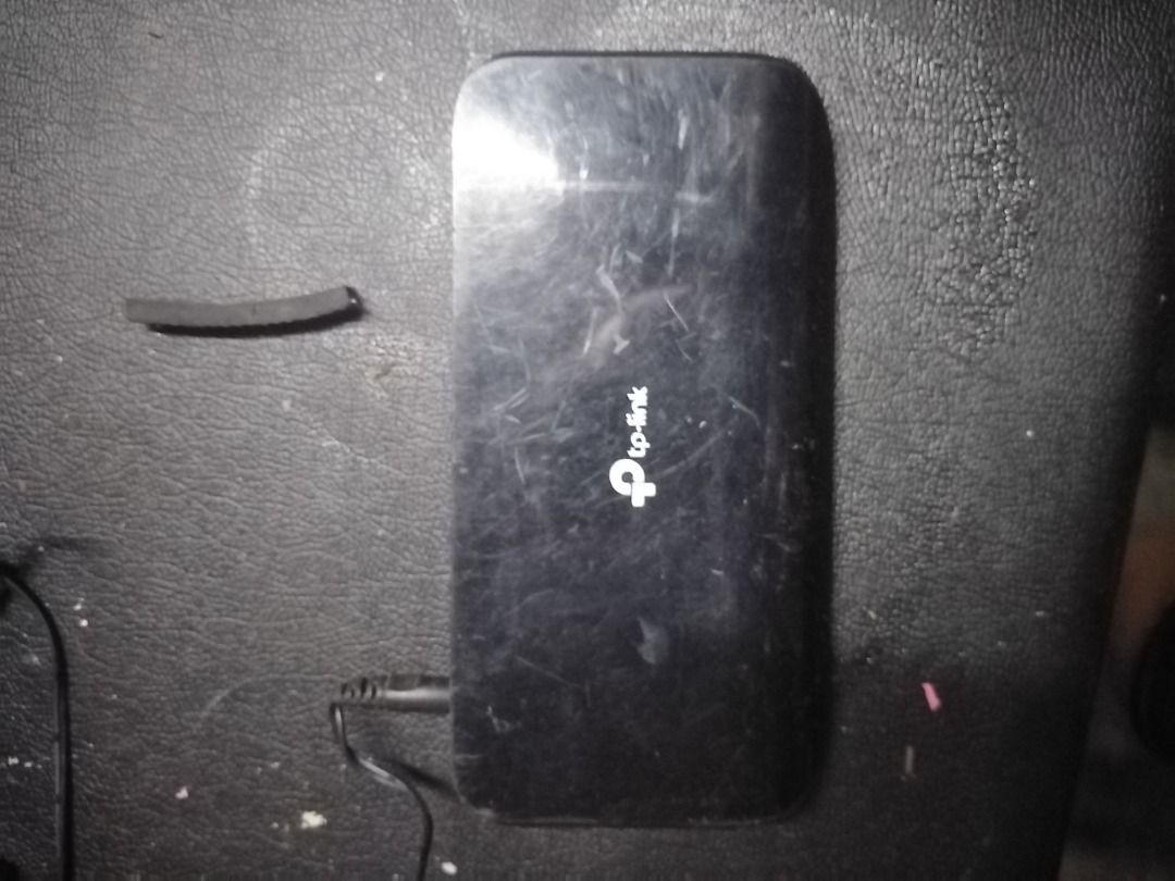 TP-Link 8-Port Gigabit Desktop Switch (Category: Networking) located in Manila. Submitted by maybonifacio (Listing ID 1430694630, Image 1). Description: TP-Link 8-Port Gigabit Desktop Switch. Model TL-SG1008D. Includes the switch and power adapter. The switch has a black finish. The device has some visible wear and tear. It is a network switch designed for connecting multiple devices to a network..