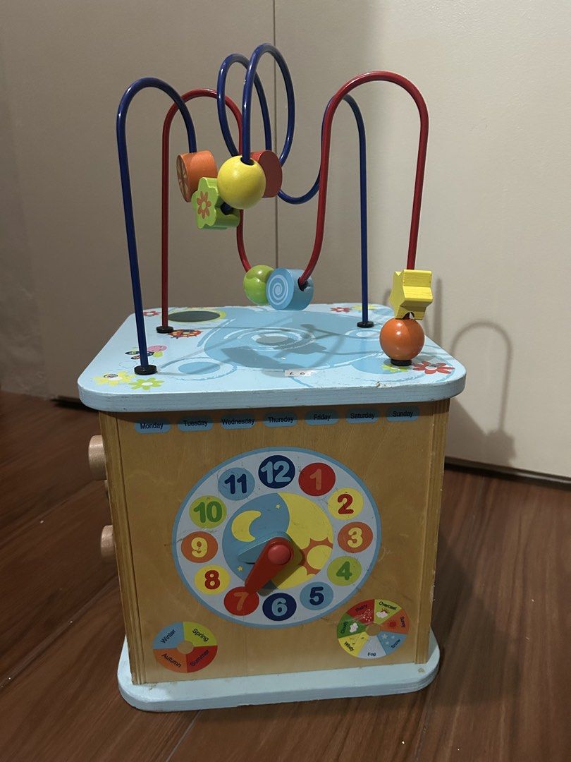 Wooden Activity Cube (Category: Infant Playtime) located in Marikina City. Submitted by cutesypatsy (Listing ID 1430727808, Image 1). Description: As is. No shapes for sorter side .
