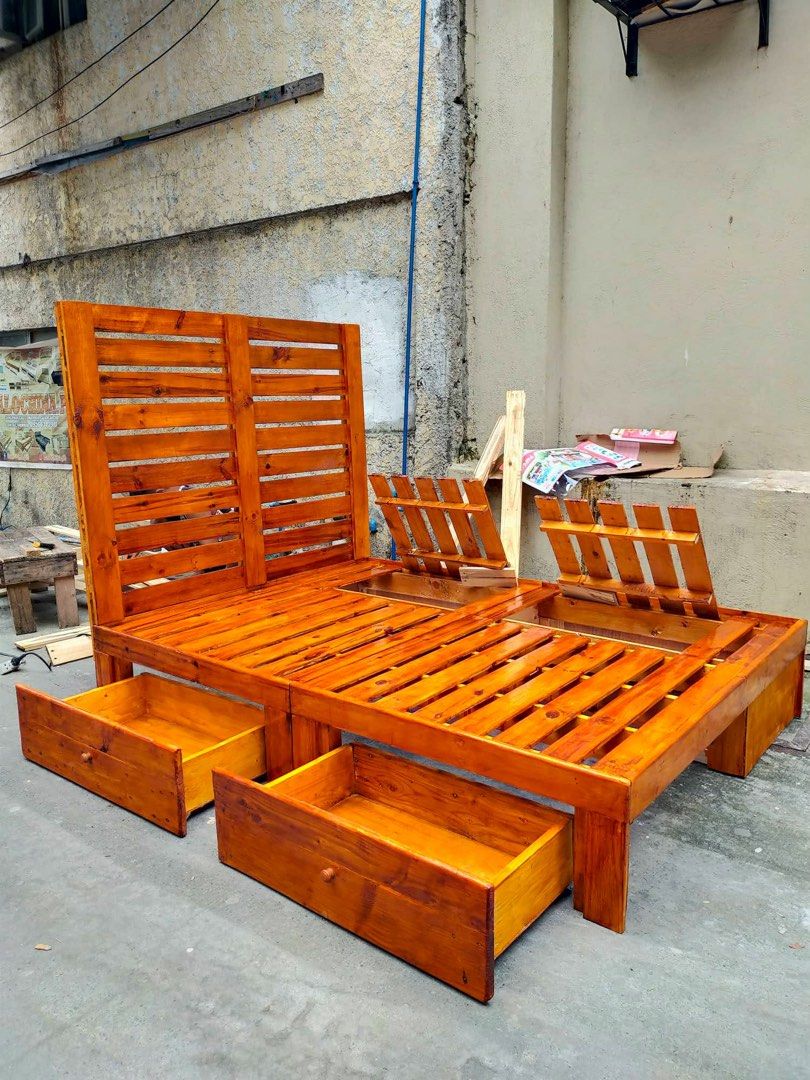 Wooden Bed Frame with Storage (Category: Bed Frames & Mattresses) located in Santa Rosa. Submitted by endlessriaa (Listing ID 1430643877, Image 3). Description: Full Double Palochina Bed Size: 54*75” 12” floor to bed with 2 secret storage 2 drawers with space on planks sa papag 42” from bed headboard collapsible with lock walnut varnished 📍 Santa Rosa, Laguna *Self booking of Lalamove or other transport services..