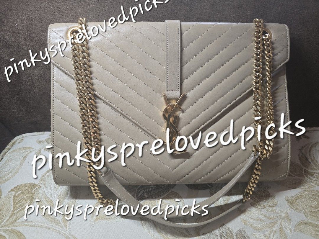 YSL Cassandre Matelasse Large Envelope Flap Bag (Category: Luxury Bags & Wallets) located in Manila. Submitted by pinkysprelovedpicks (Listing ID 1430733657, Image 1). Description: This is my original preloved YSL Bag..bought abroad..but used for special occasions only. Comes complete with cards and dustbag. PM for more complete photos. ⦁ YSL Cassandre Matelasse Large Envelope Flap Bag ⦁ Pre owned ⦁ Flaws: minor bottom scuff marks, minor signs of