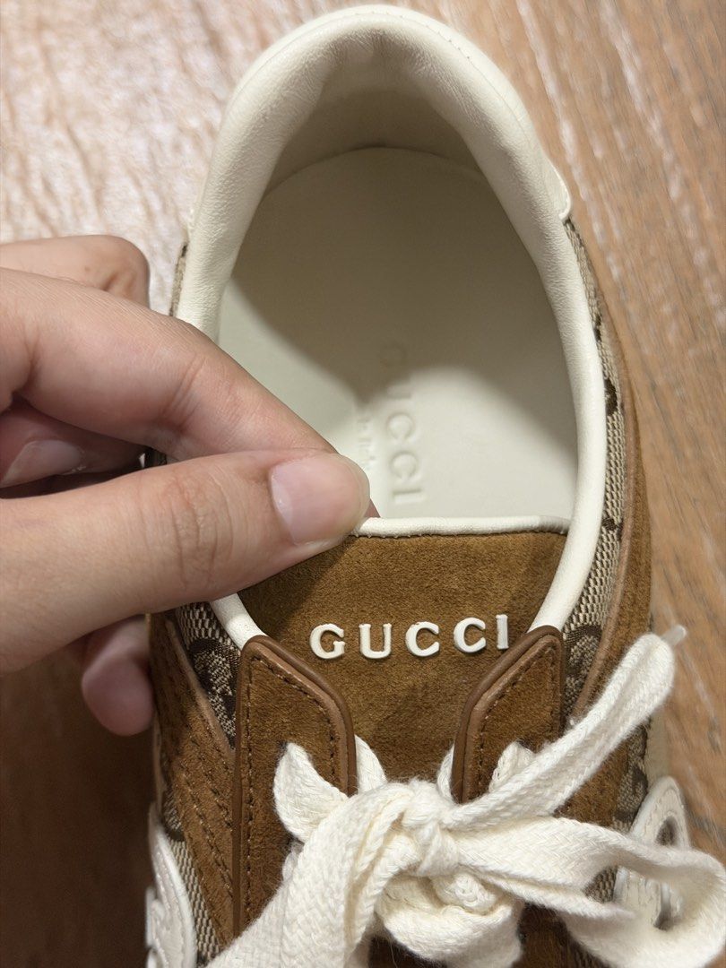 AUTHENTIC Gucci G75 Sneakers in Brown Suede (Category: Sneakers & Footwear) located in Bacoor. Submitted by da.clutter (Listing ID 1430905869, Image 3). Description: - Bought in Gucci, Solaire - Features the iconic GG monogram canvas - Accented with brown suede details - Comes with an extra pair of brown laces - Interior marked with Gucci logo and "Made in Italy" stamp - Classic design with white laces and a brown sole.