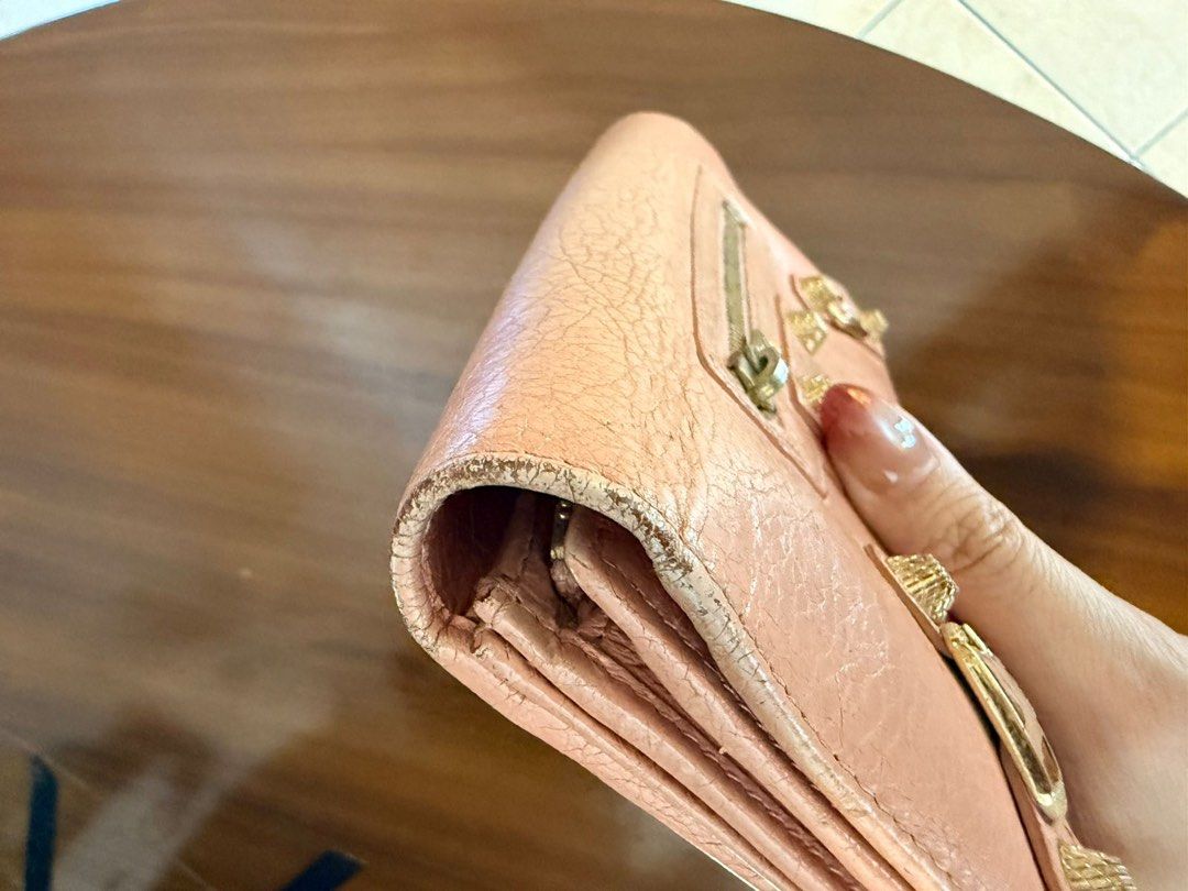 Balenciaga Classic Continental Wallet (Category: Luxury Bags & Wallets) located in Paranaque City. Submitted by gabprelovedstuff (Listing ID 1430821719, Image 3). Description: - Balenciaga Classic Continental Wallet - Blush pink color - Features textured leather - Signature hardware details - Spacious interior - Can put chain - Pre-loved condition - Tarnishing in hardware - Has rubs - Can be brought to bag spa but also ready to with its vintage l