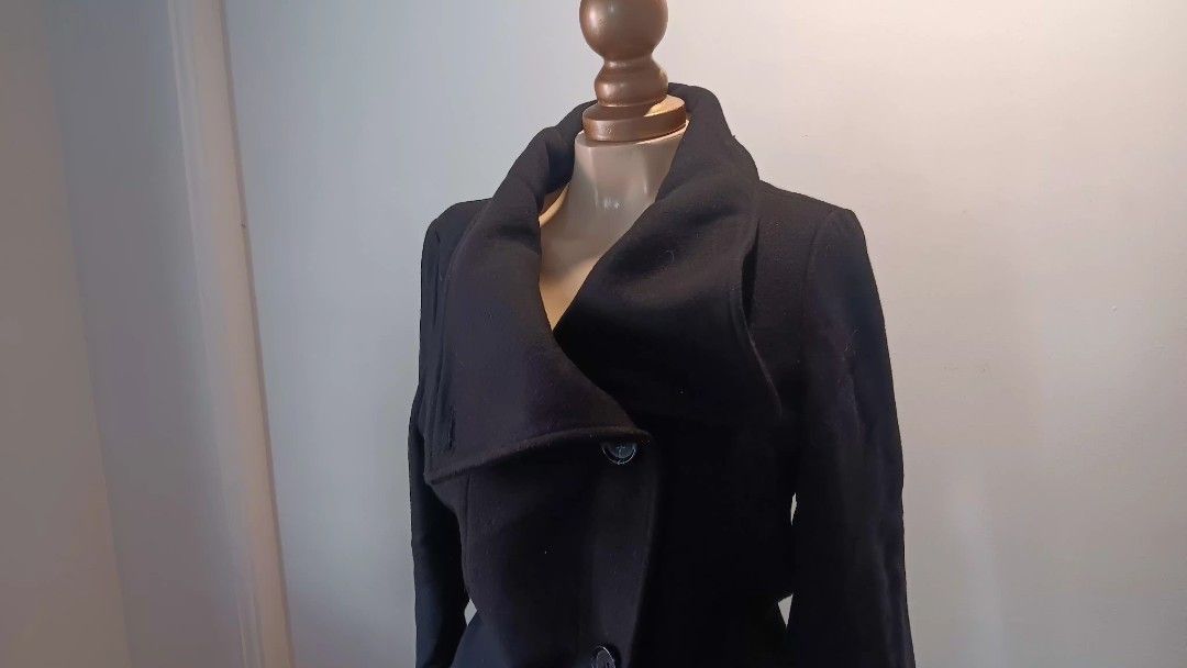 Bershka Black Coat (Category: Coats, Jackets and Outerwear) located in Manila. Submitted by sonummy (Listing ID 1430916045, Image 1). Description: Mall Price: 2,000 Elegant black coat with a unique collar design. Features a double-breasted closure with visible buttons. The fabric has a smooth texture. It is suitable for various occasions..
