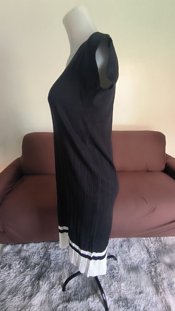 Black Knit Dress with White Hem (Category: Dresses) located in Antipolo. Submitted by secondcharmstore (Listing ID 1430833844, Image 2). Description: sale 200 Black knit dress features a flattering V-neck and cap sleeves. The dress has a ribbed texture on the bodice and a contrasting white hemline. The dress is simple yet elegant, offering a versatile addition to any wardrobe. no tag, never worn chest: 36-40 inches waist: 36-38 inches length: 42.