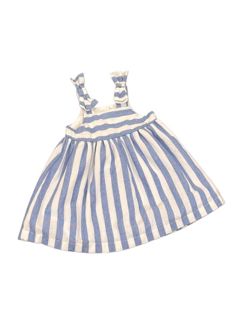 Blue and White Striped Dress (Category: Babies & Kids Fashion) located in Paranaque City. Submitted by _arysss_ (Listing ID 1430934453, Image 1). Description: Adorable blue and white striped dress. Features tie straps and a flared skirt. Perfect for a sunny day. The dress has a simple, classic design, making it a versatile addition to any wardrobe. It's lightweight and comfortable, ideal for warm weather..