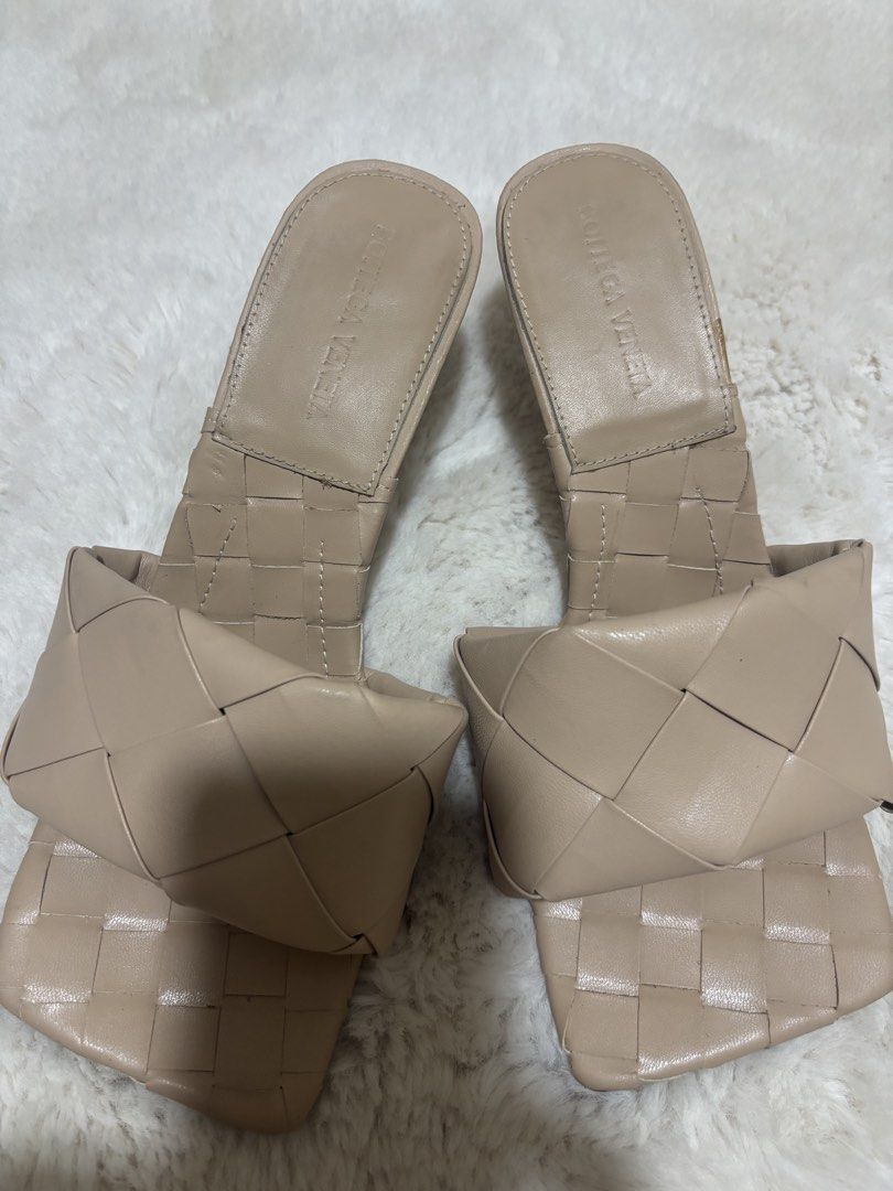 Bottega Veneta Lido Sandals-Authentic (Category: Sneakers & Footwear) located in Batangas. Submitted by aveena0413 (Listing ID 1430938578, Image 2). Description: Bottega Veneta Lido Sandals (Size 40) • Elegant neutral beige color • Signature woven strap design • Modern square toe with stiletto heels • Classic and versatile style, perfect for any outfit • With Bottega Veneta logo on the sole (still with protective plastic) • Gently used, well take