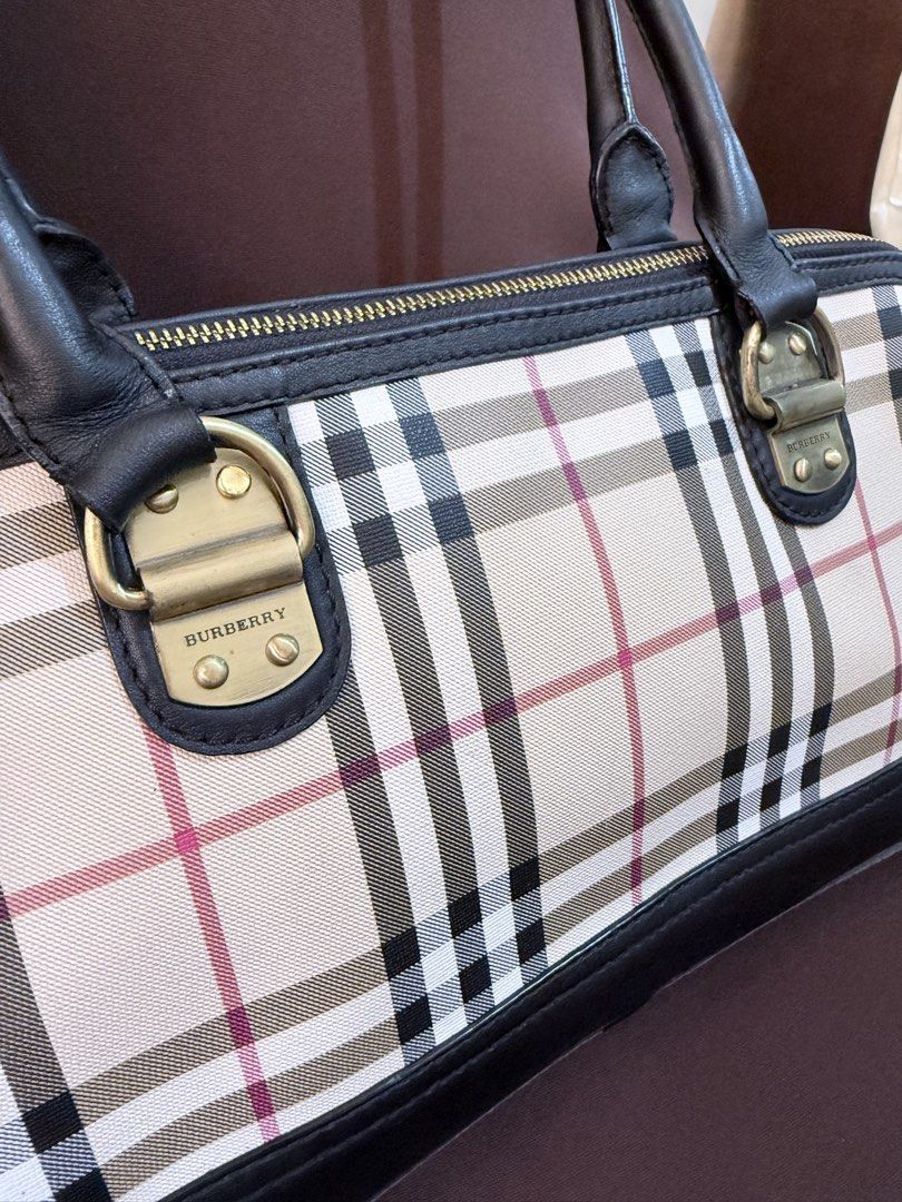 Burberry Long handle Baguette Shoulder Bag (Category: Shoulder Bags) located in Tarlac. Submitted by feebee01 (Listing ID 1430854025, Image 2). Description: fave bag pero i had to let go cause i have a lot of bags in storage NGA but overall super nice in person. issues: bakbak sa tag inside, see photo. wala na din yung leather part sa piping nya. hindi naman halata since i had it colored ng black din, see photo for reference. may onting dumi din 