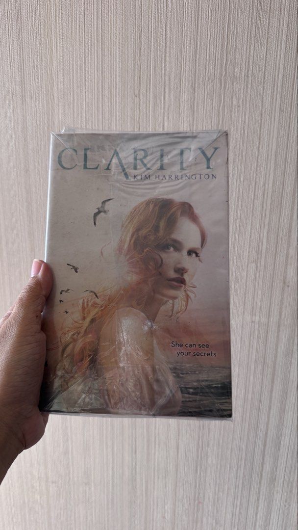 Clarity by Kim Harrington (Category: Storybooks) located in Pasay City. Submitted by zhng.cc (Listing ID 1430870687, Image 1). Description: Clarity by Kim Harrington. The book has foxing and tanning pages. The cover features a woman with red hair and the title "Clarity". A great addition to any book collection..