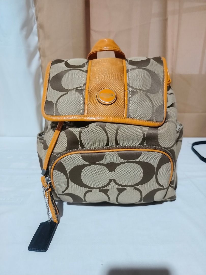 Coach Backpack (Category: Luxury Bags & Wallets) located in Marilao. Submitted by paadd (Listing ID 1430969037, Image 1). Description: Coach Backpack Black quilted leather satchel Good condition Price: 1500 Mustard yellow patent leather trim and top handle Buyer shoulders the shipping fee Meet-up available for sure buyers only SM Marilao foodcourt.